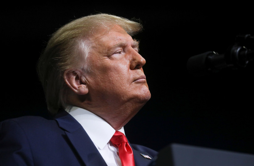 U.S. President Donald Trump pauses as he addresses his first re-election campaign rally in several months in the midst of the coronavirus disease (COVID-19) outbreak, at the BOK Center in Tulsa, Oklahoma, U.S., June 20, 2020. (photo credit: LEAH MILLIS/REUTERS)