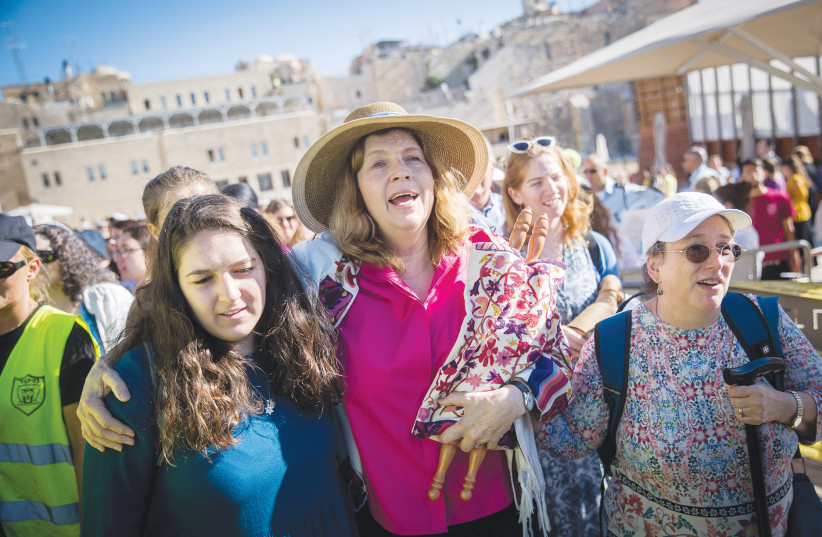 MEMBERS OF the Women of the Wall movement hold Rosh Hodesh prayers at the Western Wall last year. (photo credit: YONATAN SINDEL/FLASH90)