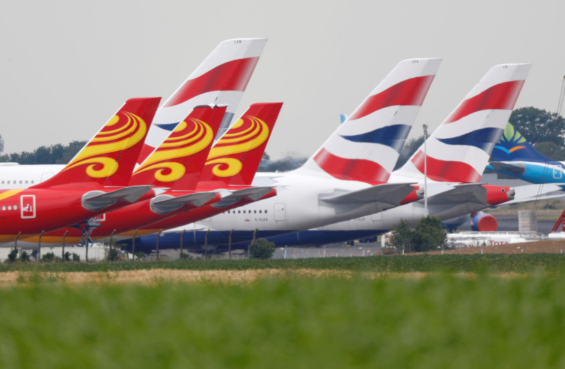FILE PHOTO: British Airways Airbus A380 airplanes and Hong Kong airlines aircrafts are parked on the tarmac of Marcel-Dassault airport at Chateauroux during the outbreak of the coronavirus disease (COVID-19) in France June 10, 2020. Picture taken June 10, 2020 (photo credit: CHARLES PLATIAU / REUTERS)