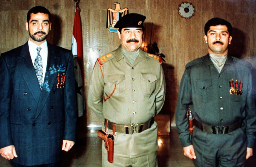Former Iraqi President Saddam Hussein C Flanked By His Two Late Sons Uday L And Qusay On