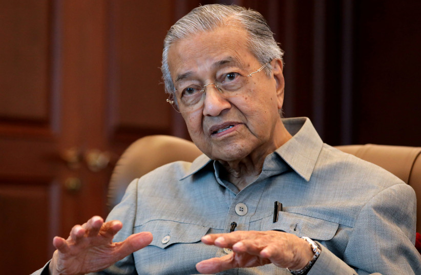 Malaysia's former Prime Minister Mahathir Mohamad speaks during an interview with Reuters in Kuala Lumpur, Malaysia, March 13, 2020 (photo credit: REUTERS/LIM HUEY TENG)