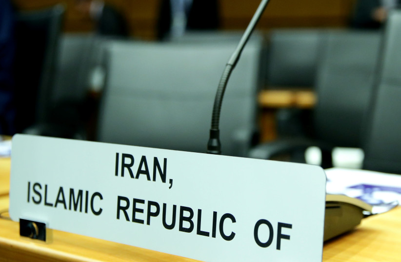 FILE PHOTO: A sign marks the seat of Iran's ambassador to the International Atomic Energy Agency (IAEA) ahead of a board of governors meeting at the IAEA headquarters in Vienna, Austria March 9, 2020 (photo credit: REUTERS/LISI NIESNER/FILE PHOTO)