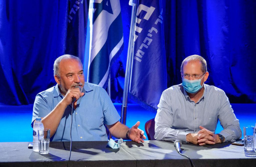 Yisrael Beytenu chairman Avigdor Liberman with MK Oded Forer during a discussion with members of the Israeli culture industry.  (credit: Courtesy)