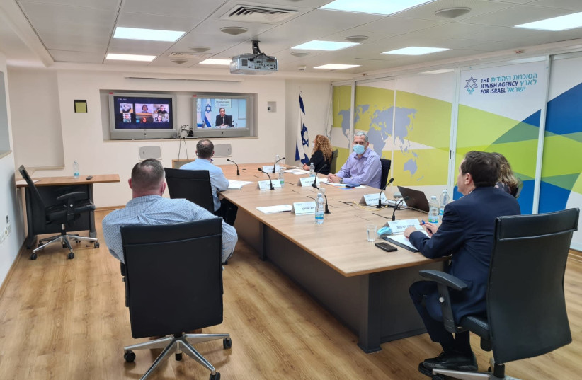 Jewish Agency Chairman Isaac Herzog is seen remotely delivering a briefing. (credit: COURTESY OF THE JEWISH AGENCY)
