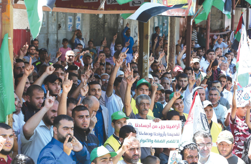 WHILE THE application of sovereignty can become a defining moment in the conflict, it is not paradigm-changing. Pictured: Palestinian supporters of Hamas attend a rally against Israel’s West Bank annexation plans, in Rafah in the southern Gaza Strip, earlier this month.  (photo credit: ABED RAHIM KHATIB/FLASH90)