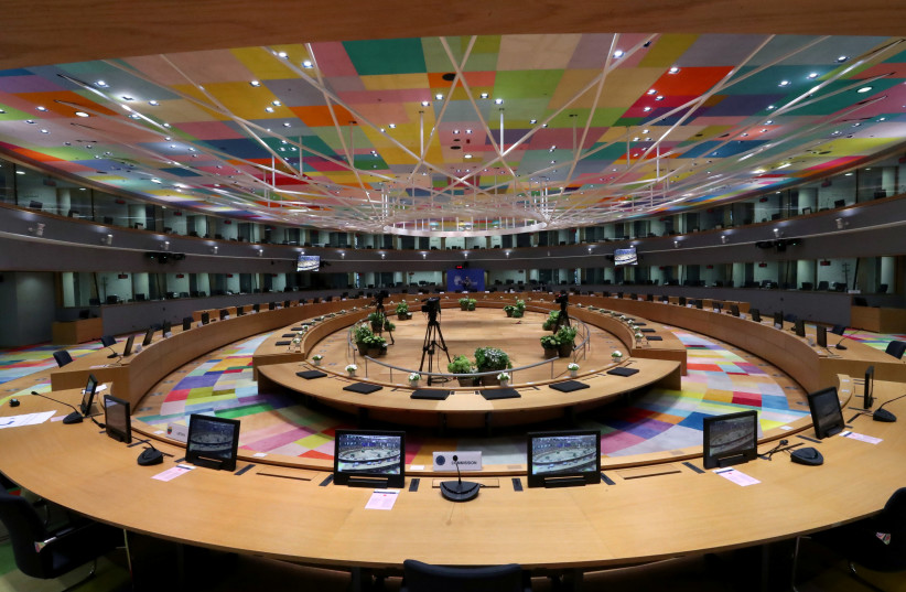 The meeting room where an EU leaders summit will take place is seen especially adapted to keep the social distancing amid the coronavirus outbreak, at the European Council headquarters in Brussels, Belgium July 16, 2020. (photo credit: YVES HERMAN / REUTERS)