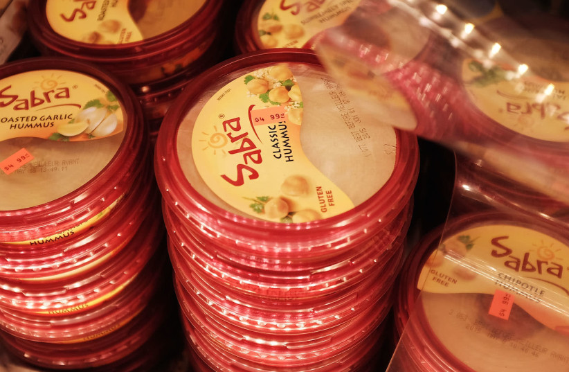 Cases of Sabra Classic Hummus are viewed on the shelf of a grocery store on April 9, 2015 in New York City (photo credit: SPENCER PLATT/GETTY IMAGES/JTA)