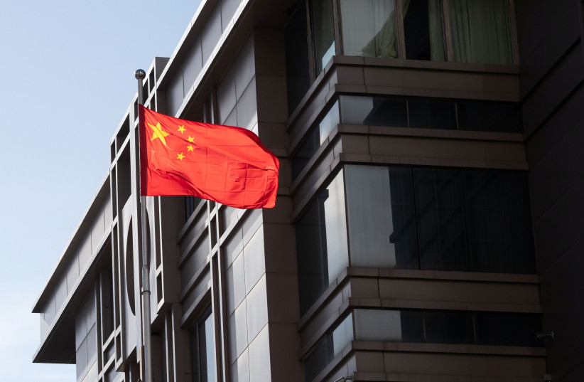 China’s national flag is seen waving at the China Consulate General in Houston, Texas (photo credit: REUTERS/ADREES LATIF)