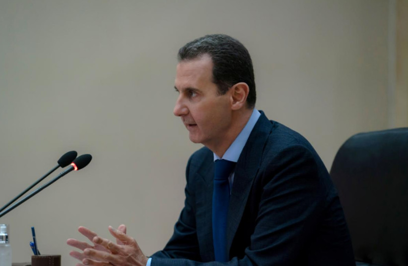 Syrian President Bashar al-Assad addresses the government committee that oversees measures to curb the spread of the coronavirus disease (COVID-19), in Damascus, Syria (photo credit: SANA/REUTERS)