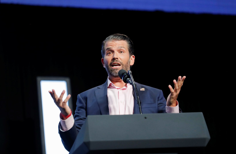 Donald Trump Jr. speaks to young people waiting to hear his father, U.S. President Donald Trump, deliver an "Address to Young Americans" at the Dream City Church in Phoenix, Arizona, U.S., June 23, 2020 (photo credit: REUTERS/CARLOS BARRIA)