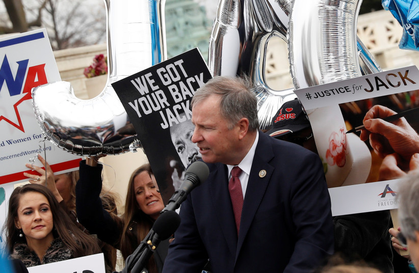 Congressman Doug Lamborn (R-CO) speaks to demonstrators following oral arguments in the Masterpiece Cakeshop vs. Colorado Civil Rights Commission case at the Supreme Court in Washington, US, December 5, 2017.  (photo credit: AARON P. BERNSTEIN/ REUTERS)