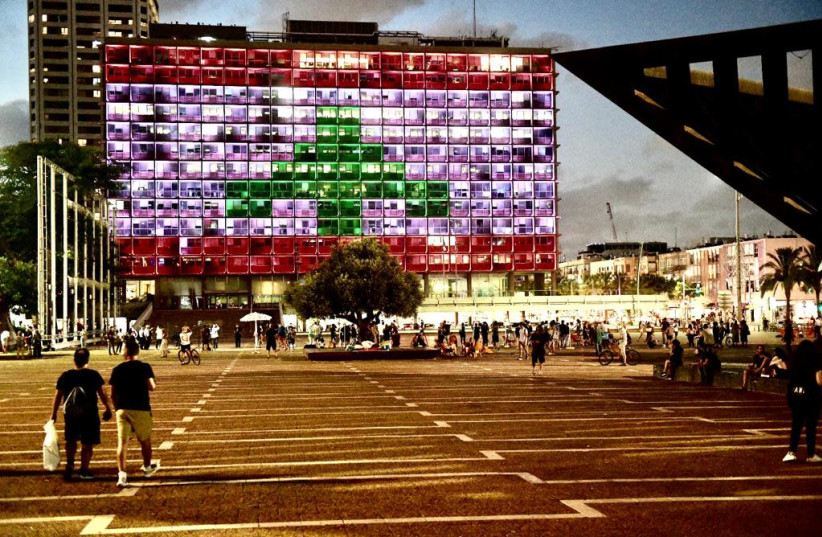 Tel Aviv Municipality lit up with the Lebanese flag, August 5, 2020. (photo credit: SASSONI AVSHALOM)