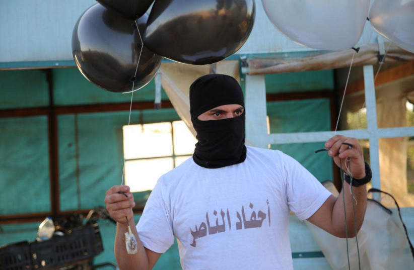 Gaza balloon units prepare incendiary and explosive balloons to launch towards Israel, August 2020 (photo credit: AHFAD AL-NASSER BALLOON UNIT/TELEGRAM)