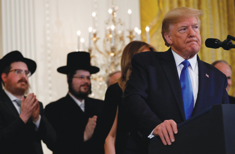 US PRESIDENT Donald Trump signs an executive order against antisemitism at the White House last year. (photo credit: TOM BRENNER/REUTERS)