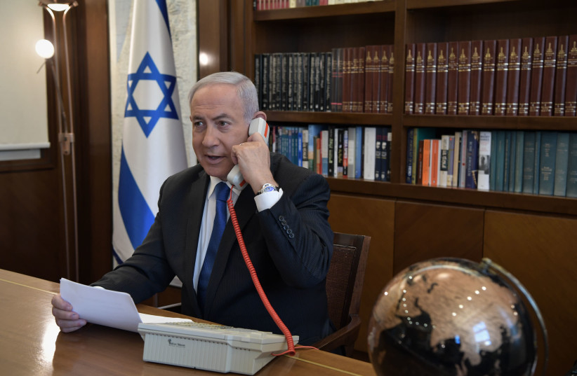 Prime Minister Benjamin Netanyahu speaks with US President Donald Trump and UAE Crown Prince Sheikh Mohammed bin Zayed via telephone. (photo credit: KOBI GIDEON/GPO)