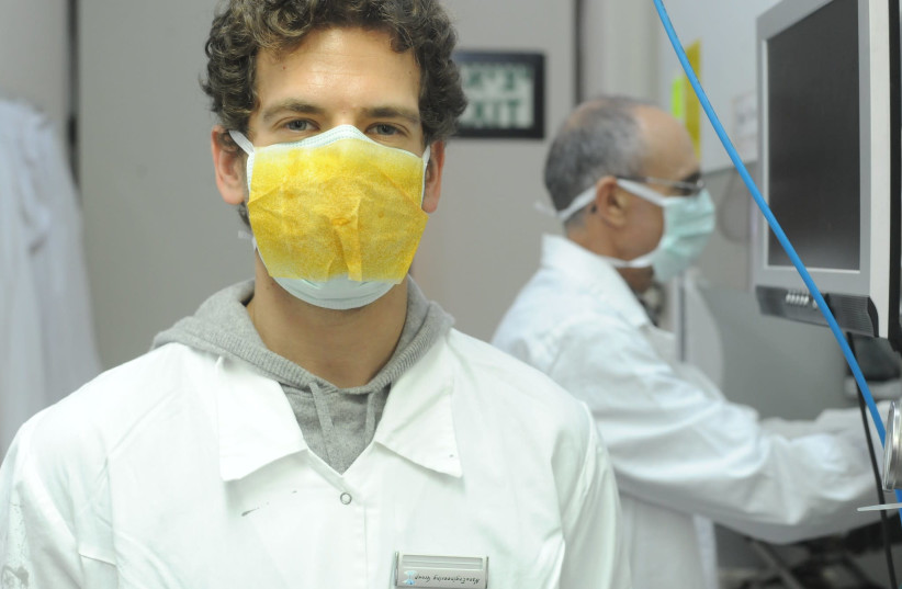 The 'Maya' sticker can easily be applied to a protective mask. (photo credit: TECHNION)