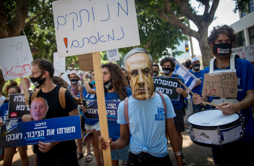 Israeli self-employed protest the lack of financial support from the Israeli government in times of Corona, when many find themselves unemployed, on Rothschild Boulevard in Tel Aviv, July 7, 2020.  (photo credit: MIRIAM ALSTER/FLASH90)
