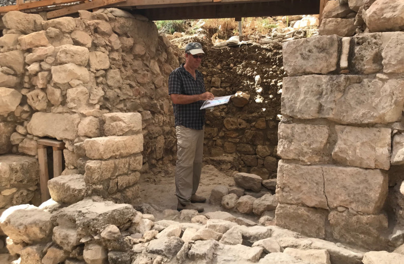 Tel Aviv University Prof. Yuval Gadot in the remains of the building destroyed by the Babilonyans in 586 BCE at the Givati Parking Lot Excavation at the City of David, Jerusalem. (credit: ROSSELLA TERCATIN)