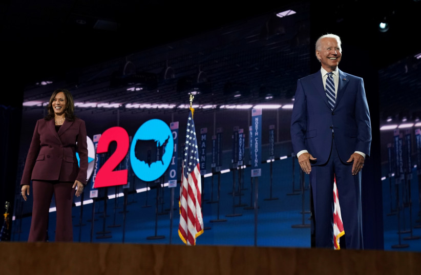 U.S. Senator Kamala Harris (D-CA) is joined on stage by her running-mate, U.S Democratic presidential nominee Joe Biden, after she accepted the Democratic vice presidential nomination during an acceptance speech delivered for the largely virtual 2020 Democratic National Convention from the Chase Cen (photo credit: REUTERS/KEVIN LAMARQUE)