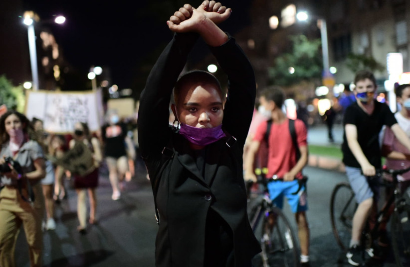 Israelis take part in a demonstration in support of the 16-year-old victim of a gang rape in Eilat, Tel Aviv, August 23, 2020 (photo credit: TOMER NEUBERG/FLASH90)