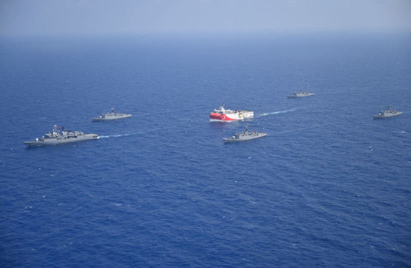 Turkish seismic research vessel Oruc Reis is escorted by Turkish Navy ships as it sets sail in the Mediterranean Sea, off Antalya, Turkey, August 10, 2020 (photo credit: TURKISH DEFENCE MINISTRY/HANDOUT VIA REUTERS)