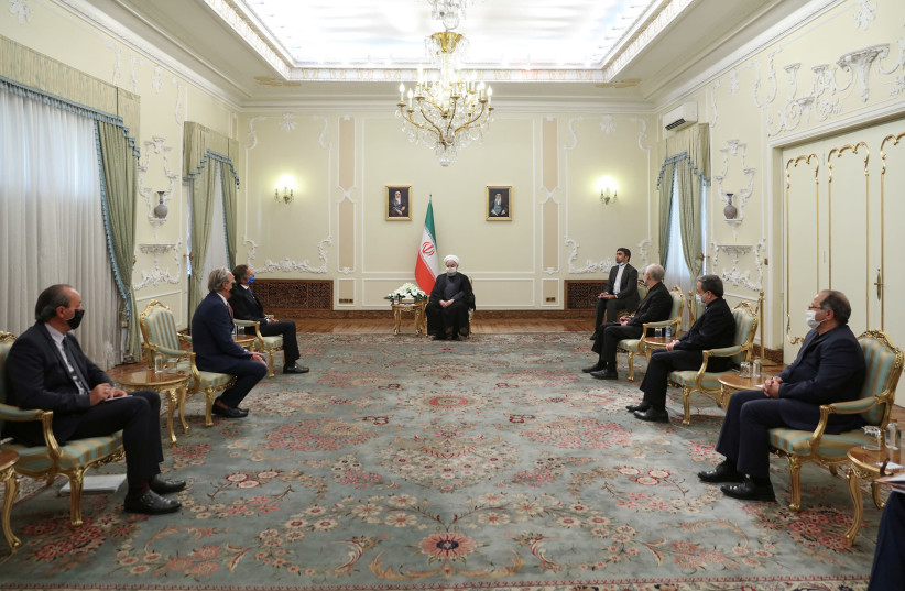 Iranian President Hassan Rouhani meets with International Atomic Energy Agency (IAEA) Director General Rafael Grossi in Tehran, Iran August 26, 2020 (photo credit: OFFICIAL PRESIDENT WEBSITE/HANDOUT VIA REUTERS)