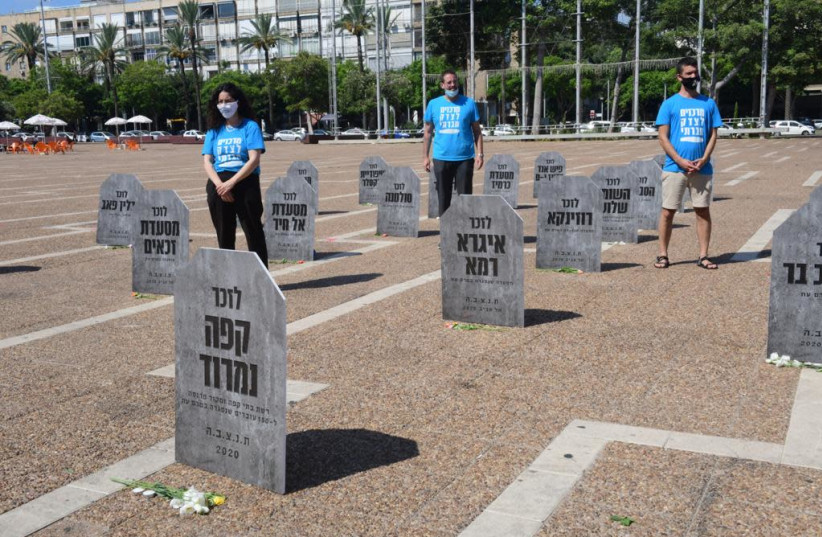 The Centers for Social Justice install a graveyard of businesses that have closed down during the coronavirus pandemic, August 26, 2020.   (credit: AVSHALOM SASSONI)