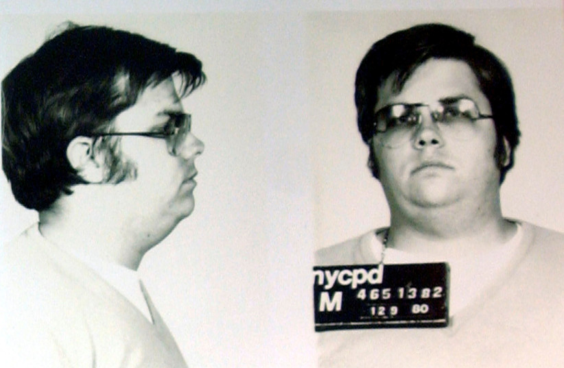 A mug-shot of Mark David Chapman, who shot and killed John Lennon, is displayed on the 25th anniversary of Lennon's death at the NYPD in New York December 8, 2005. (photo credit: REUTERS)