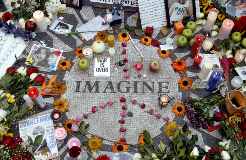 Memorabilia lie on circle with the word Imagine on it to honor deceased John Lennon in Central Park's Strawberry Fields in New York December 8, 2005. Former Beatles member Lennon was shot and killed by Mark David Chapman in front of his apartment twenty five years ago. (credit: REUTERS)