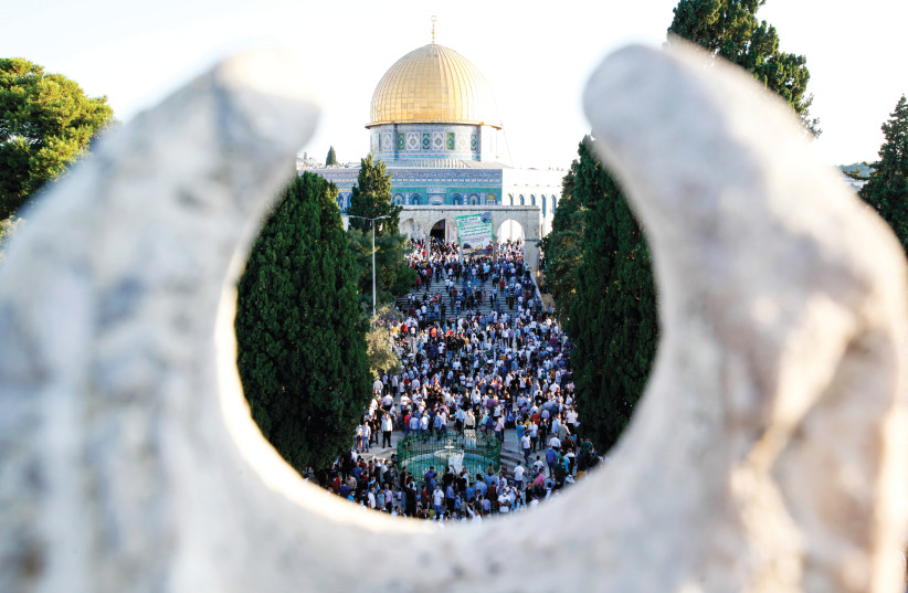 SOCIAL DISTANCE doesn’t seem to be a thing among those attending Eid al-Adha prayers in the Old City’s al-Aqsa compound on July 31 (photo credit: SLIMAN KHADER/FLASH90)