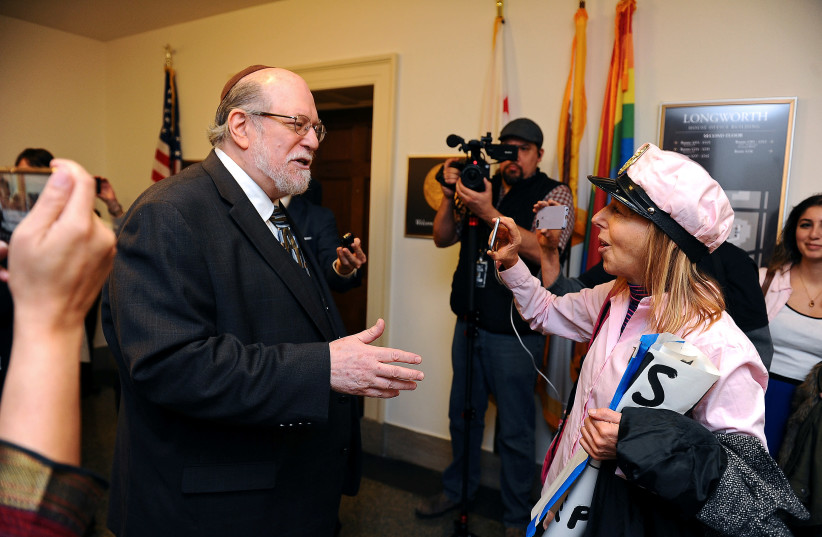 Rabbi Aryeh Spero of NCJA debates Medea Benjamin of Code Pink at House Speaker Nancy Pelosi’s office in Washington (photo credit: MARY F. CALVERT / REUTERS)