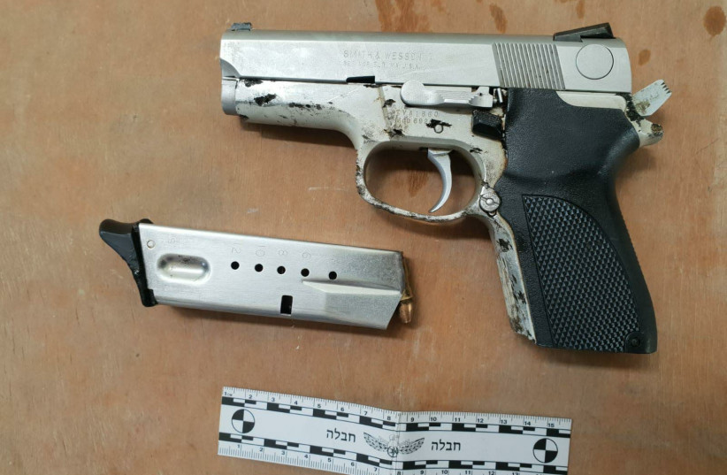 A Smith & Wesson handgun stolen from an Israeli citizen 20 years ago was found by border crossing officials in the possession of two attempted smugglers. (photo credit: DEFENSE MINISTRY)