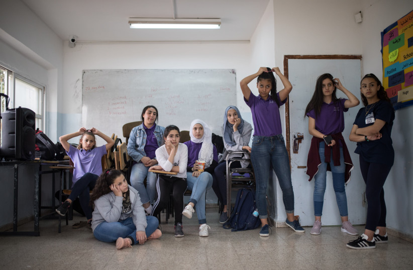 Young female students at a dancing lesson with Israeli teacher Neria Cohen, at the Arab private school, Promise, in Beit Hanina, East Jerusalem, on May 6, 2018. (photo credit: HADAS PARUSH/FLASH90)