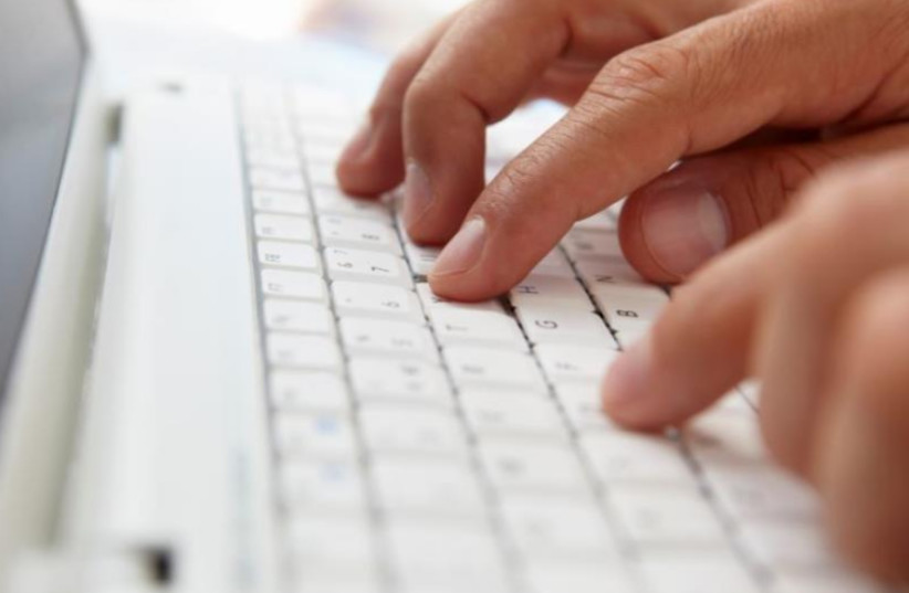 Writing on a computer keyboard [Illustrative] (photo credit: ING IMAGE)