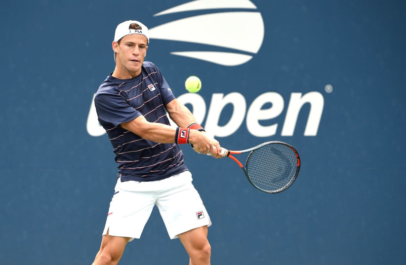 EWISH-ARGENTINE DIEGO SCHWARTZMAN hits a return on Monday night during his five-set defeat to Brit Cameron Norrie in the first round of the US Open in New York. (credit: USTA/COURTESY)