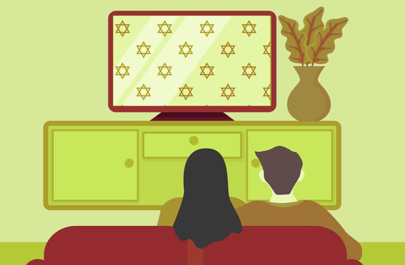 A man and woman watching Jewish TV.  (photo credit: AR DUCHA MISFA'I / GETTY IMAGES)