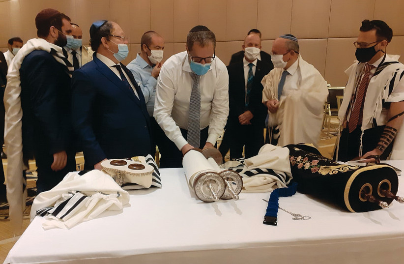 JEWISH MEMBERS OF the visiting Israeli and American delegations (including National Security Adviser Meir Ben-Shabbat, second right) hold a morning minyan this week in Abu Dhabi. (credit: COURTESY RAPHAEL AHERN/TIMES OF ISRAEL)