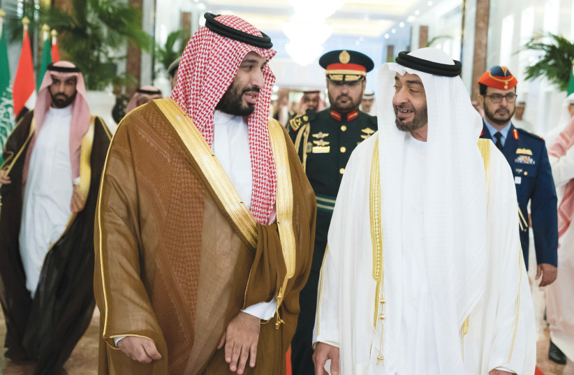 ABU DHABI’S Crown Prince Sheikh Mohammed bin Zayed Al Nahyan receives Saudi Crown Prince Mohammed bin Salman at the Presidential Airport in Abu Dhabi in November. (photo credit: WAM/REUTERS)