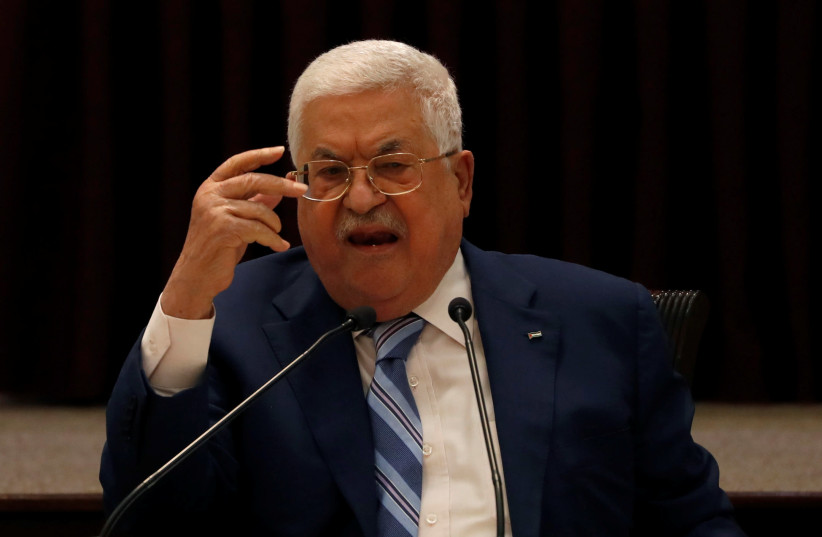 President Mahmoud Abbas gestures during a meeting with the Palestinian leadership to discuss the United Arab Emirates' deal with Israel to normalize relations, in Ramallah in the Israeli-occupied West Bank August 18, 2020 (photo credit: REUTERS/MOHAMAD TOROKMAN/POOL)
