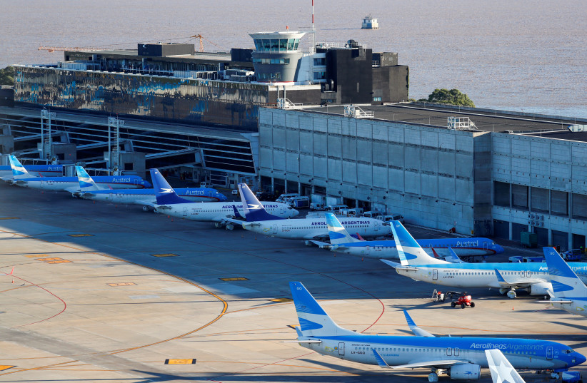 Aerolineas Argentinas' passenger planes are seen parked at Jorge Newbery domestic airport, as the spread of the coronavirus disease (COVID-19) continues, in Buenos Aires, Argentina April 29, 2020 (photo credit: REUTERS/AGUSTIN MARCARIAN)