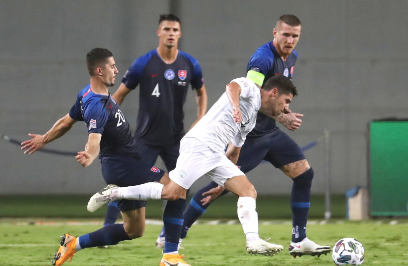 ISRAEL FORWARD Manor Solomon (in white) battles for the ball against a trio of Slovakian opponents during the blue-and-white’s 1-1 draw with Slovakia on Monday night in Nations League action in Netanya (photo credit: REUTERS)