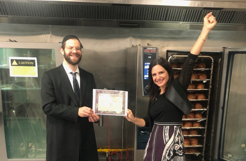 Kriel celebrates with OU Israel’s Rabbi Yissichar Dov Krakowski after the kitchen of St. Regis Hotel in Abu Dhabi was made kosher, with assistance from Godrume Kriel of the South African Beth Din (photo credit: Courtesy)