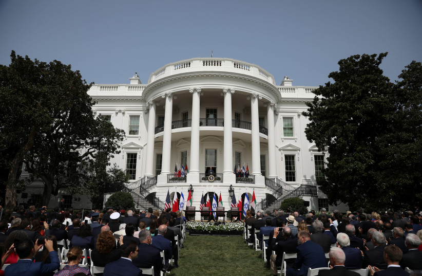 US President Donald Trump speaks as Israel's Prime Minister Benjamin Netanyahu, United Arab Emirates (UAE) Foreign Minister Abdullah bin Zayed and Bahrain’s Foreign Minister Abdullatif Al Zayani listen before the signing of the Abraham Accords. South Lawn of the White House in Washington, US, Septem (photo credit: REUTERS/TOM BRENNER)