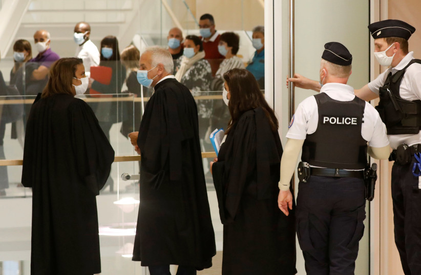 Lawyers arrive at the courtroom on the opening day of the trial of the January 2015 Paris attacks against Charlie Hebdo satirical weekly, a policewoman in Montrouge and the Hyper Cacher kosher supermarket, at Paris courthouse, France, Steptember 2, 2020. (photo credit: REUTERS)