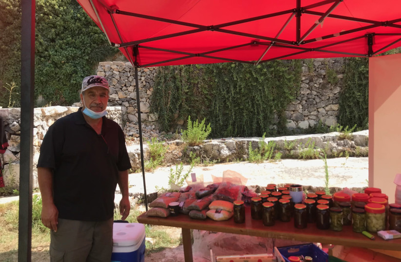 Naser Rabah and his wares. ‘Farmers are not getting any support.’ September 2020 (photo credit: FATINA HAMAD)
