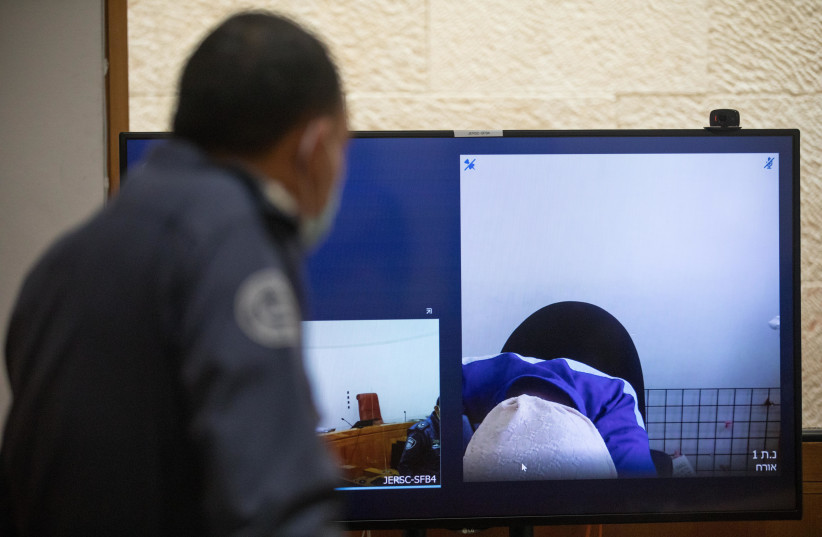 Malka Leifer, An Ultra orthodox teacher wanted in Australia for child sex abuse, seen on a screen via a video link during a court hearing at the Supreme Court in Jerusalem on July 29, 2020. (photo credit: YONATAN SINDEL/FLASH90)