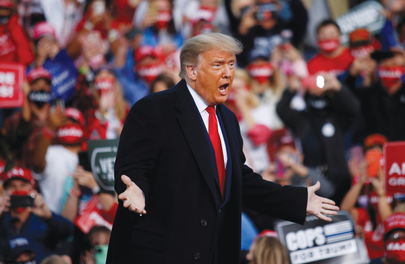 US PRESIDENT Donald Trump gestures during a campaign event in Fayetteville, North Carolina, September 19, 2020 (photo credit: REUTERS/TOM BRENNER)