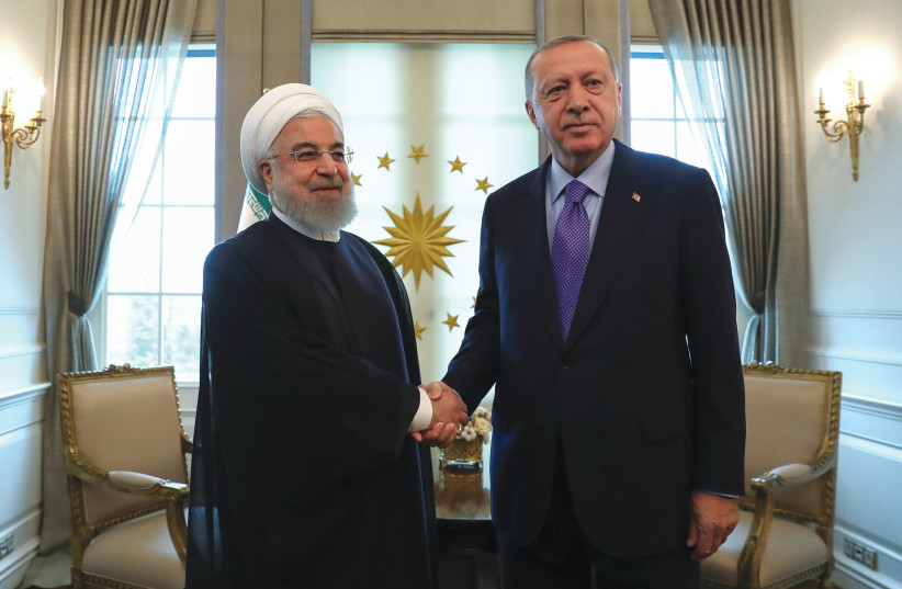 TURKISH PRESIDENT Recep Tayyip Erdogan greets Iranian President Hassan Rouhani in Ankara, September 2020 (photo credit: ERDEM SAHIN/REUTERS)