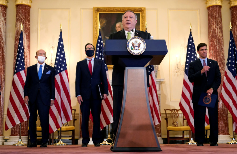 U.S. Secretary of State Mike Pompeo speaks next to Commerce Secretary Wilbur Ross, Treasury Secretary Steve Mnuchin, and Defense Secretary Mark Esper, during a news conference to announce the Trump administration's restoration of sanctions on Iran, at the U.S. State Department in Washington, U.S., S (photo credit: PATRICK SEMANSKY/POOL VIA REUTERS)