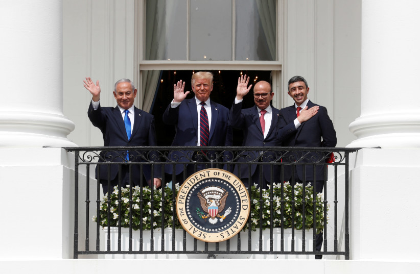 Prime Minister Benjamin Netanyahu, US President Donald Trump, Bahrain’s Foreign Minister Abdullatif Al Zayani and United Arab Emirates Foreign Minister Abdullah bin Zayed wave from the White House balcony after a signing ceremony for the Abraham Accords on the South Lawn of the White House on Septem (photo credit: REUTERS//TOM BRENNER)